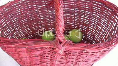 Green apple in the basket