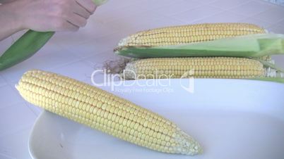 peeling corncobs