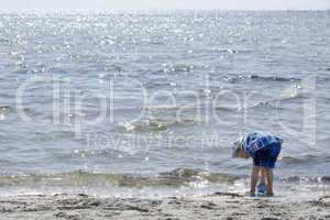 boy playing at the beach