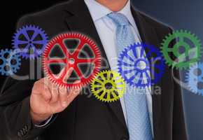 Businessman turning wheels