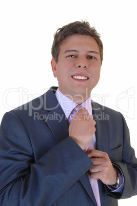 man fixing his tie.