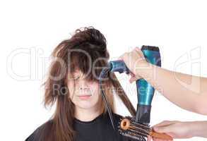 woman enjoying having her hair blow dried