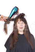 woman enjoying having her hair blow dried