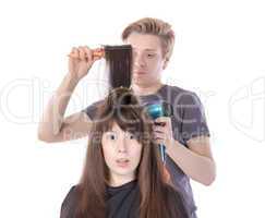 woman enjoying having her hair blow dried