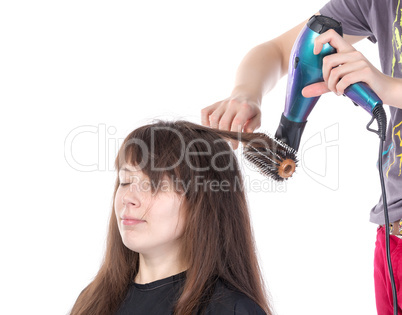 woman enjoying having her hair blow dried