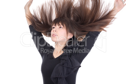 young woman with her hair flying in the air