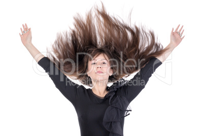 young woman with her hair flying in the air
