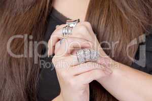 woman wearing multiple rings