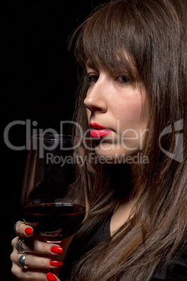 young woman with red wine from a glass