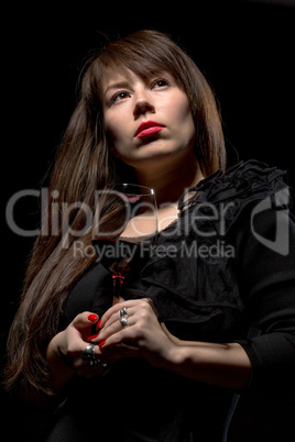 young woman with red wine from a glass