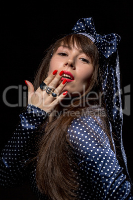 elegant sensual woman applying red lipstick