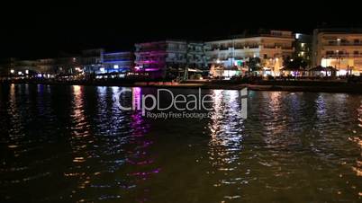 illuminated waterfront buildings at night