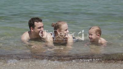 Young family in the sea