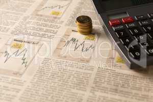 newspaper stock market with calculator and money