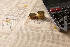 newspaper stock market with calculator and money