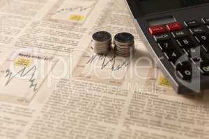 newspaper stock market with calculator and money