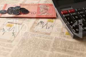 newspaper stock market with calculator and money