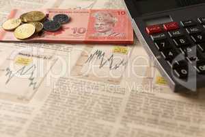 newspaper stock market with calculator and money