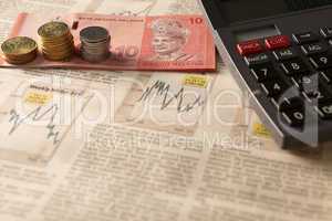 newspaper stock market with calculator and money