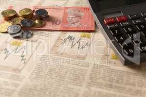 newspaper stock market with calculator and money