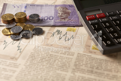 newspaper stock market with calculator and money