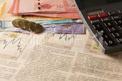newspaper stock market with calculator and money