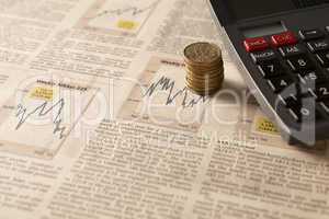 newspaper stock market with calculator and money