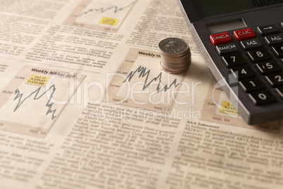 newspaper stock market with calculator and money