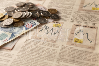 newspaper stock market with money