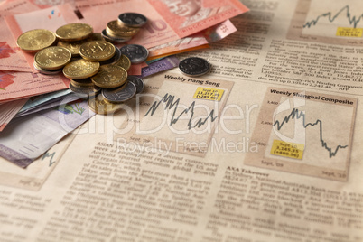 newspaper stock market with money