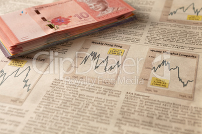 newspaper stock market with money