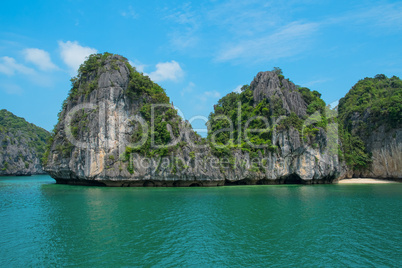 mountain island and lonely beach in halong bay