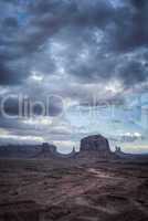 big cloud horizontal on mesa in monument valley