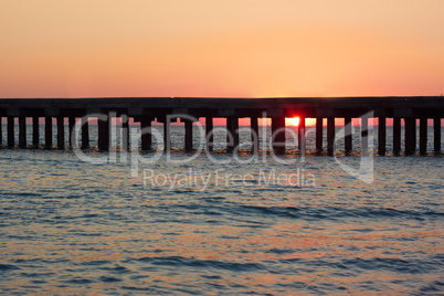old sea pier at sunset