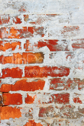 old brick wall covered with cement and lime