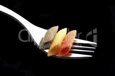 italian penne pasta on a fork