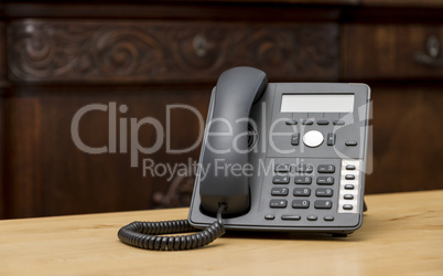 phone on wooden table in living room