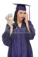 stressed female graduate holding stacks of hundred dollar bills