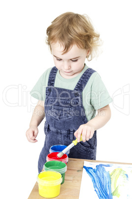 child with brush and paint in white background