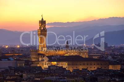 sunset view of the palazzo della signoria tower, florence