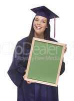 mixed race female graduate in cap and gown holding chalkboard.