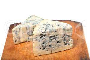 dorblu cheeses on old wooden kitchen board