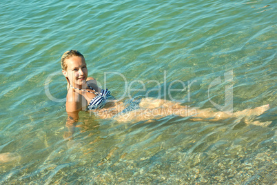 teen girl on the coastal seawater