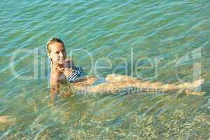 teen girl on the coastal seawater