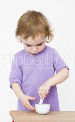 child working with mortar