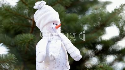 Christmas snowman on pine tree