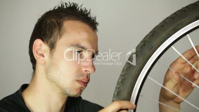 Man repairing bicycle