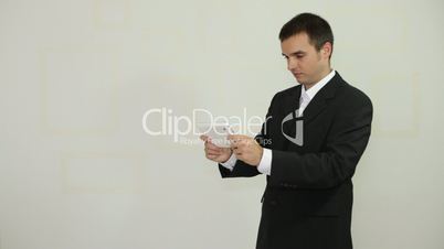 Businessman playing game on digital tablet