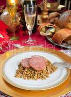 Slices of pig trotter with lentils over christmas table