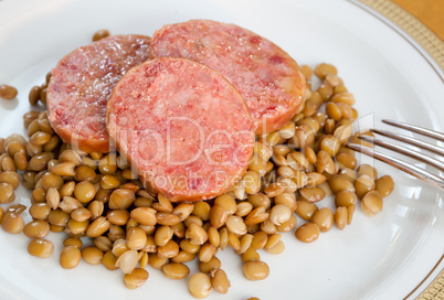 Pig trotter with lentils, traditional italian food